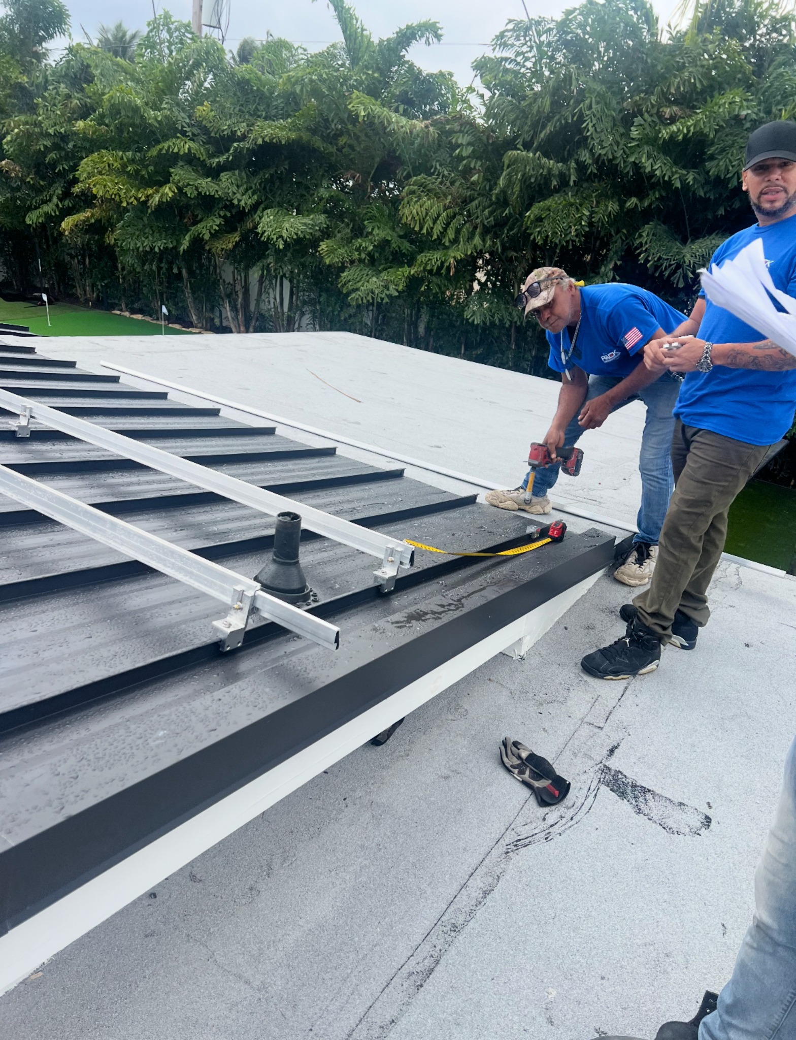 Solar field crew on roof